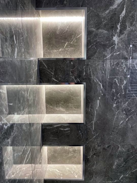 Lit shower niches in grey marble