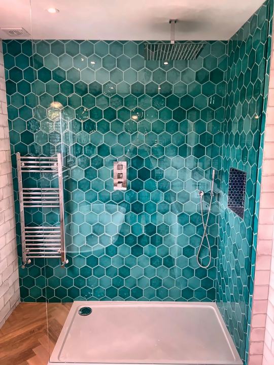 Teal hex walk-in shower