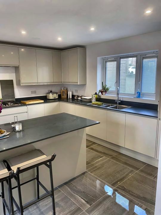 Cream gloss kitchen with island