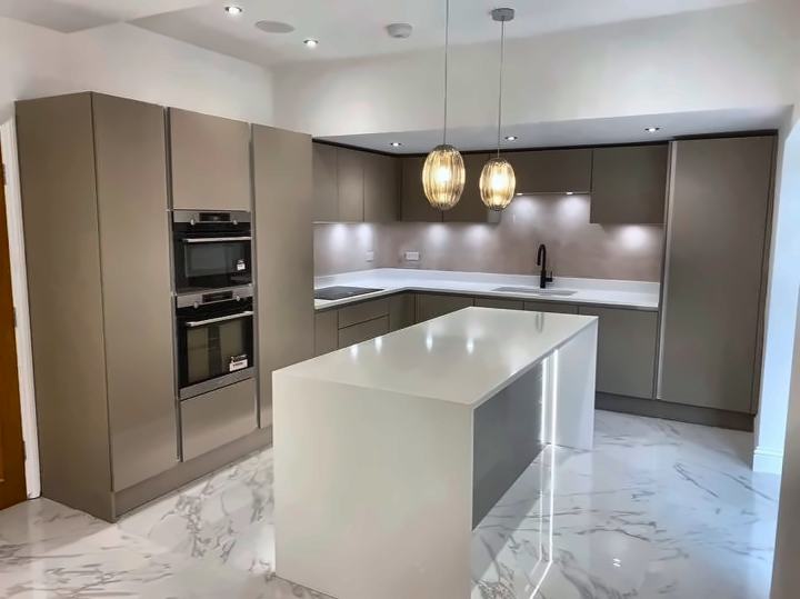 Handleless grey kitchen with lit island
