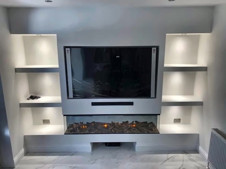 Media wall with lit shelving