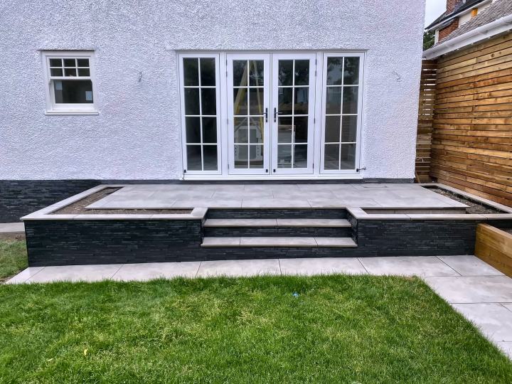 Raised patio with slate-clad steps
